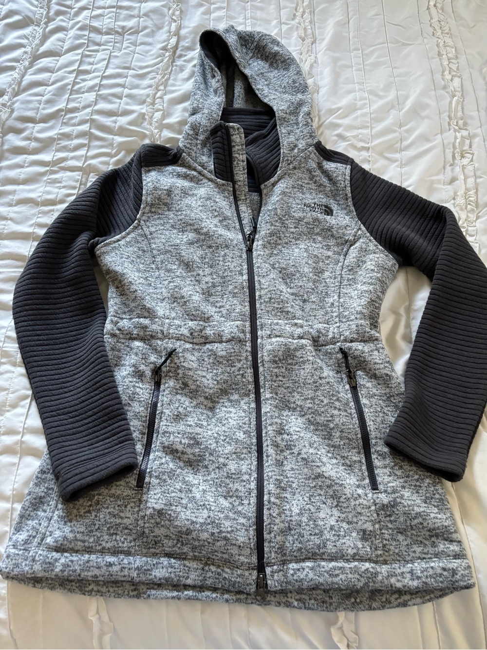 The North Face woman’s ' Gray Hooded Zip Jacket with Black Sleeves